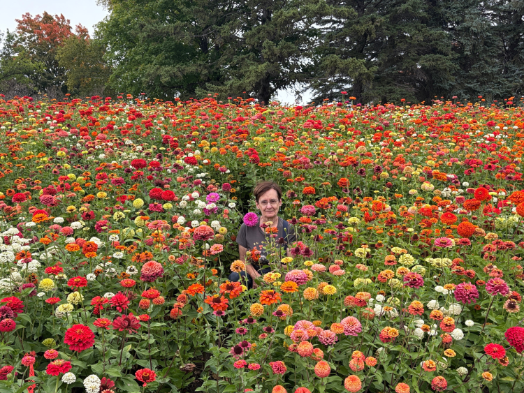 Janet Kurtz in a field of flowers