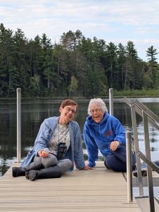 Jan and Dolly sitting on the dock